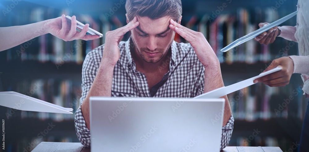 Composite image of businessman stressed out at work