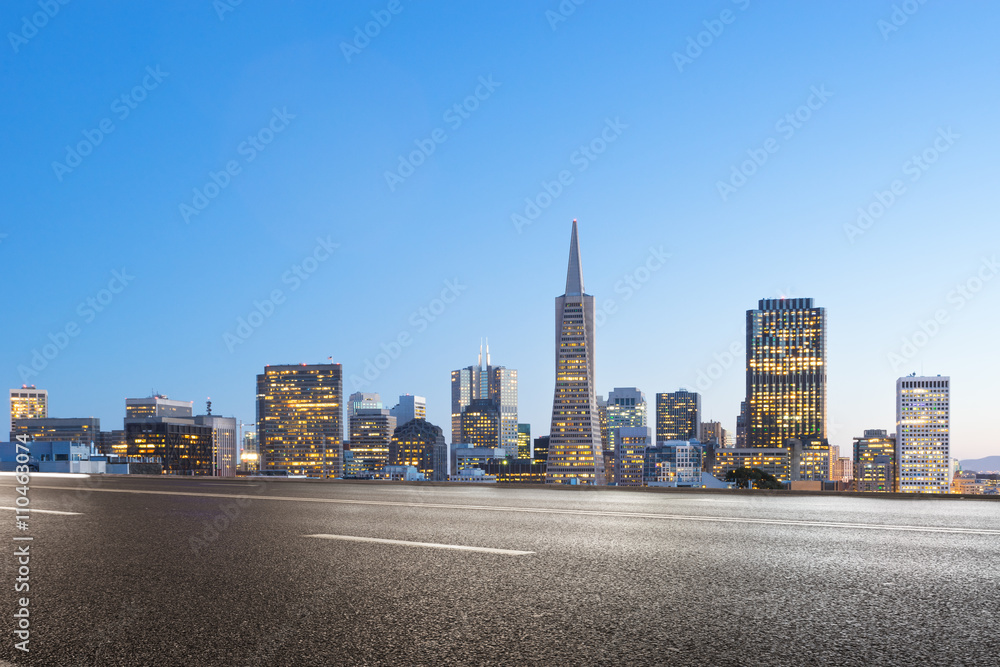 empty asphalt road with cityscape and skyline of san francisco