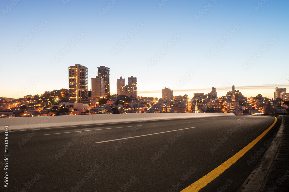 empty asphalt road with cityscape and skyline of san francisco