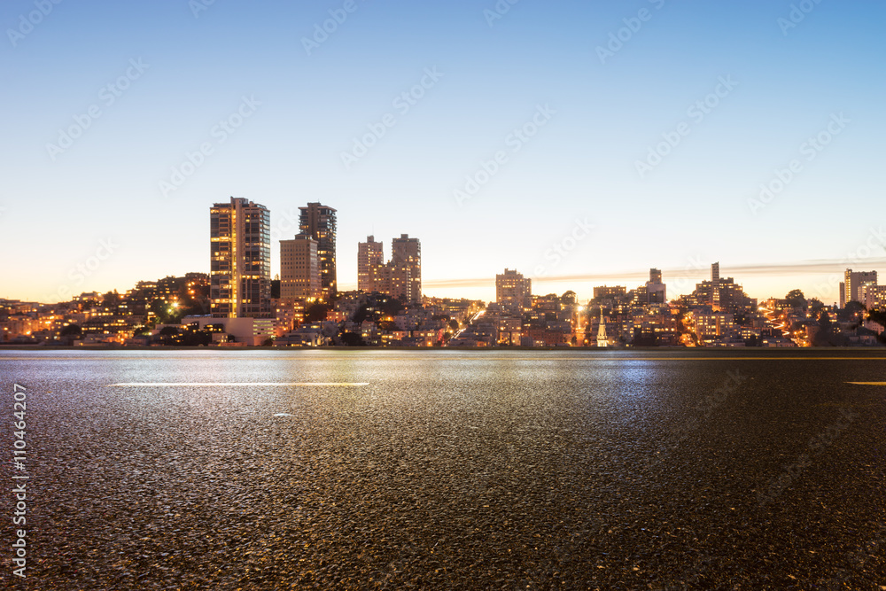 empty asphalt road with cityscape and skyline of san francisco