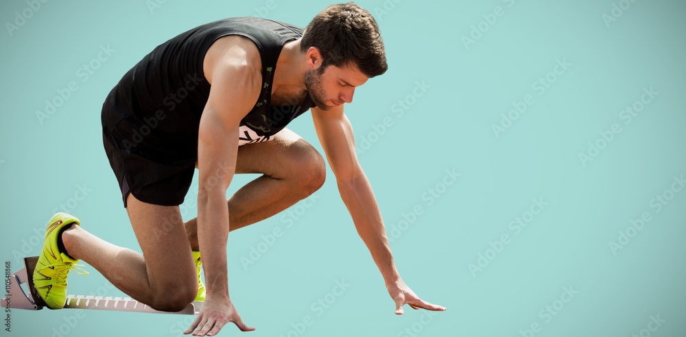 Composite image of portrait of sportsman waiting on the starting