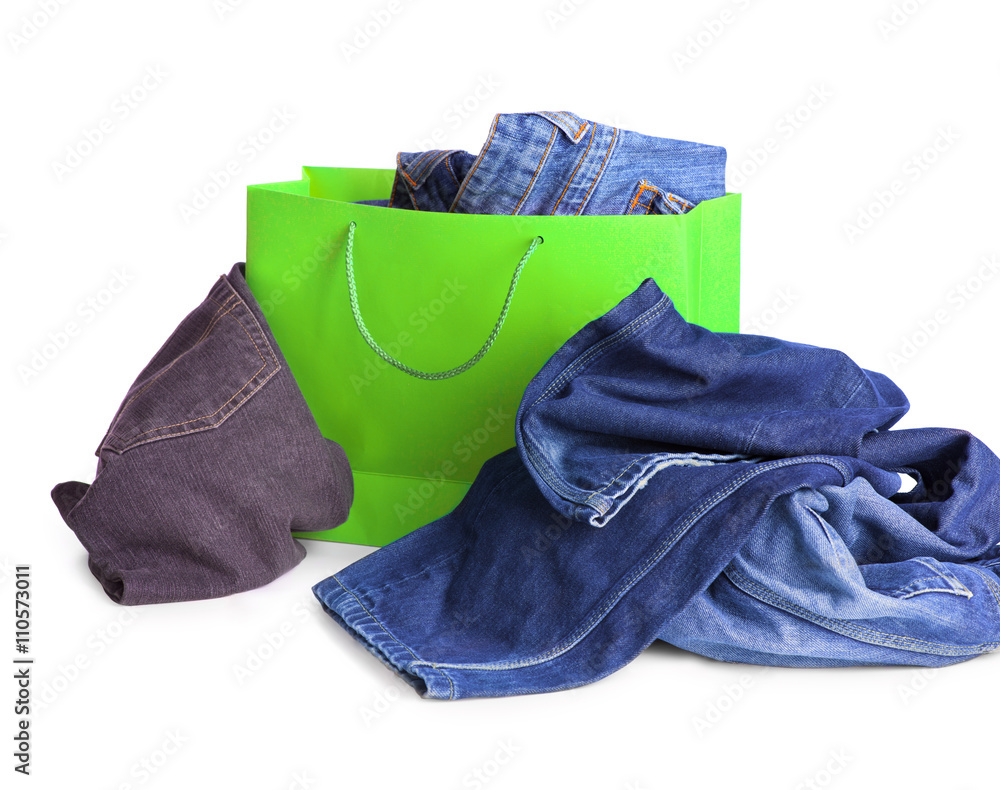 Jeans in the shopping bag on white