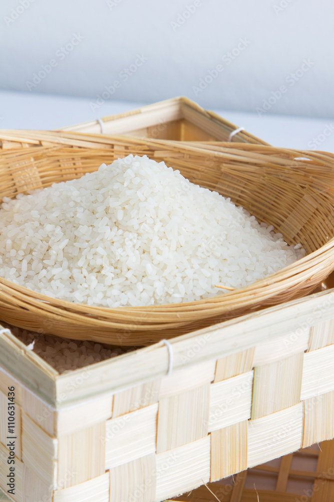 Raw and uncooked rice in basket weave,shallow Depth of Field,Focus on rice. 