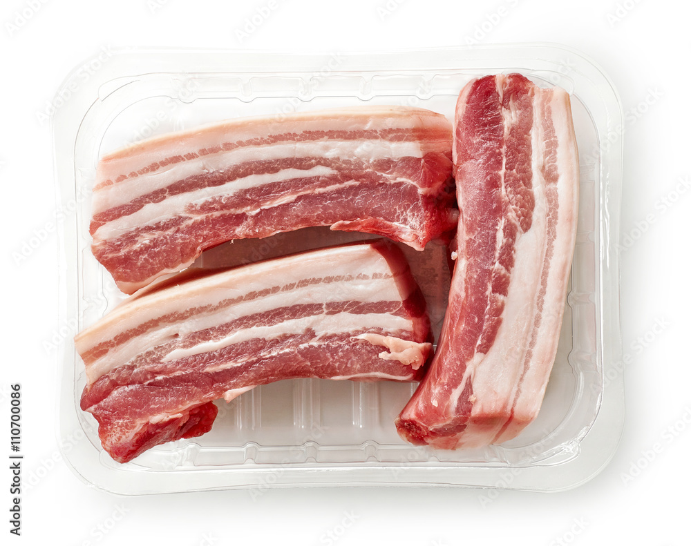 raw bacon pieces in plastic try