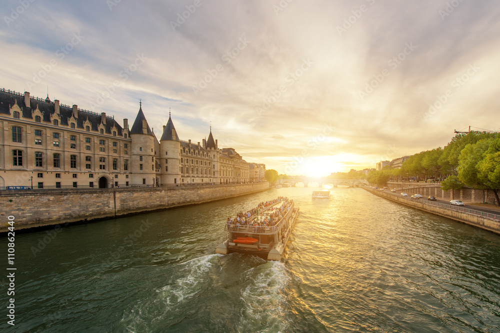 Boat tour on Seine river with sunset in Paris, France