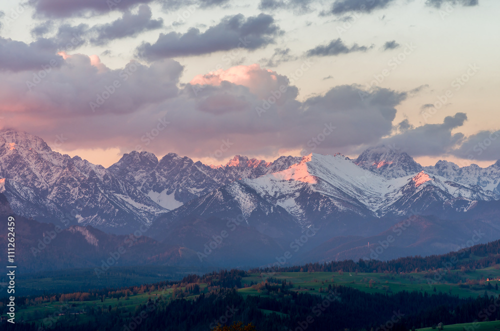 Cloudy Tatra mountains in the morning, covered with snow