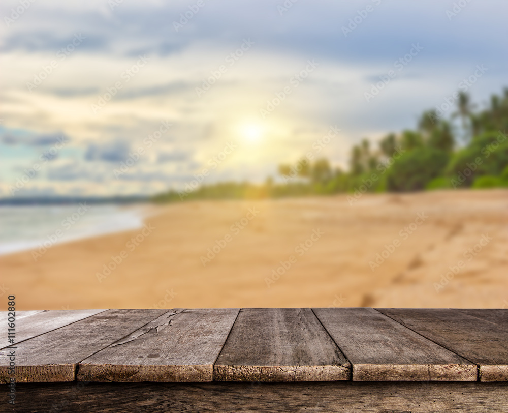 Summer sandy beach with wooden planks