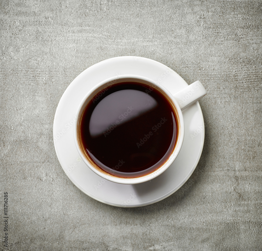 cup of coffee on gray table