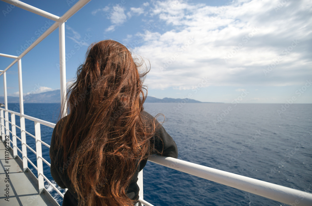 Passenger of cruise ship looking at sea