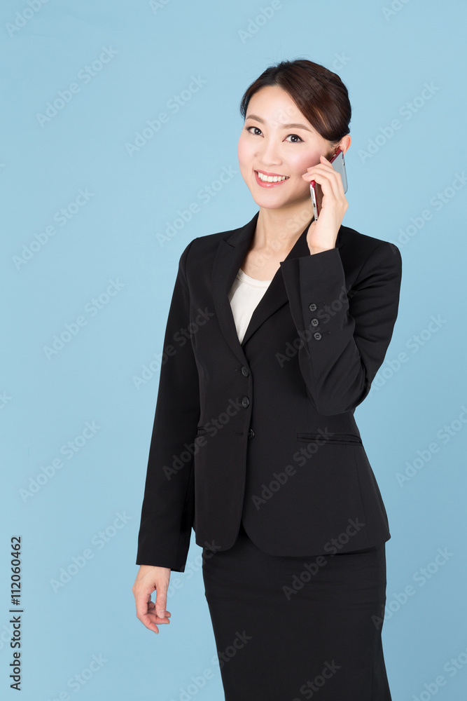 portrait of asian businesswoman isolated on blue background