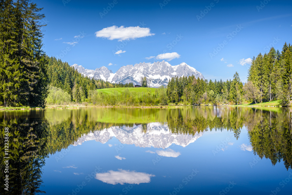 Wilder Kaiser reflecting in mountain lake, Kitzbühel, Tyrol, Austria