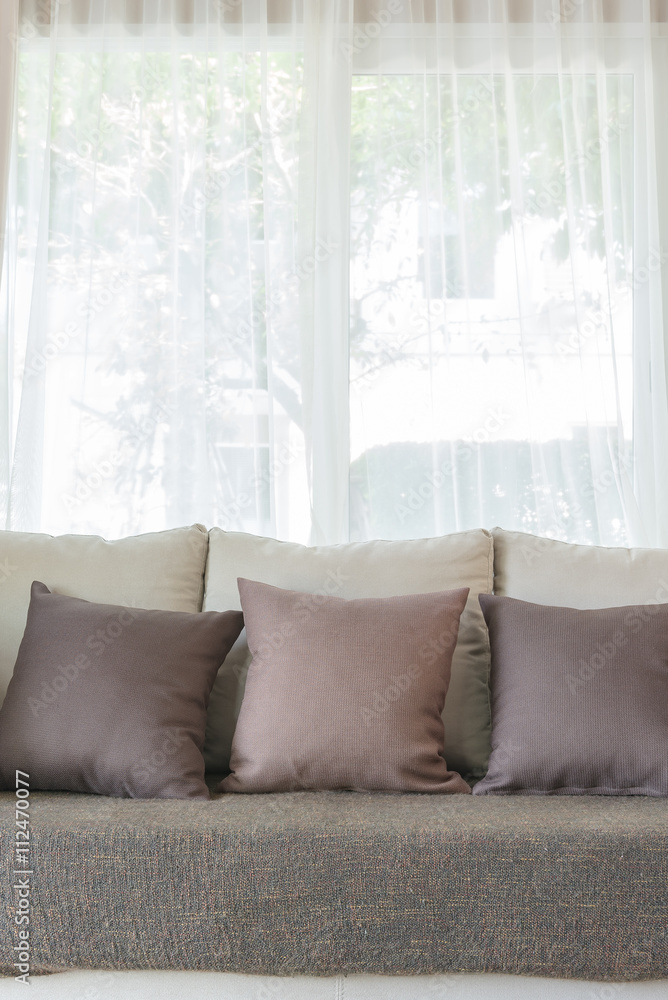 modern sofa and set of pillows in modern bedroom design