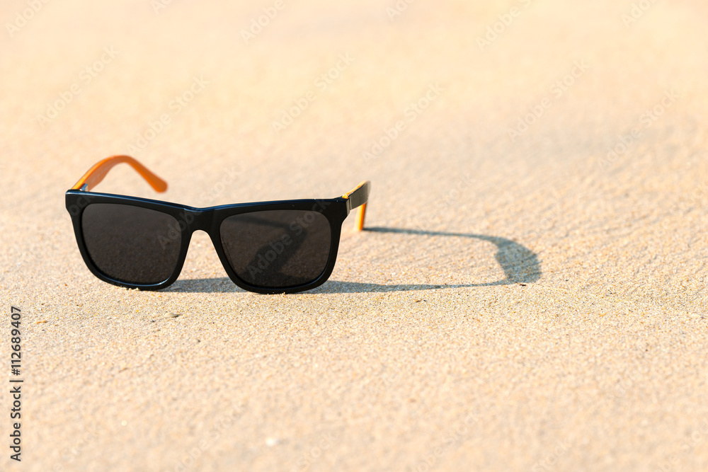 Sun glass on beach.