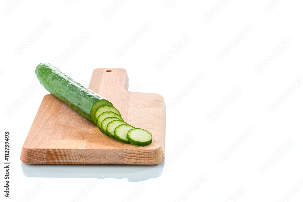 Fresh Cucumber slices on wood  cutting board