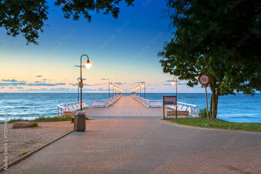 Wooden pier in Gdynia Orlowo at sunrise, Poland