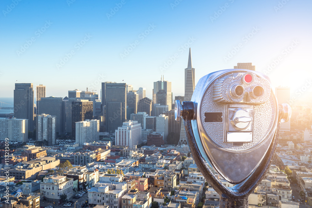 telescope with cityscape and skyline of san francisco at sunrise