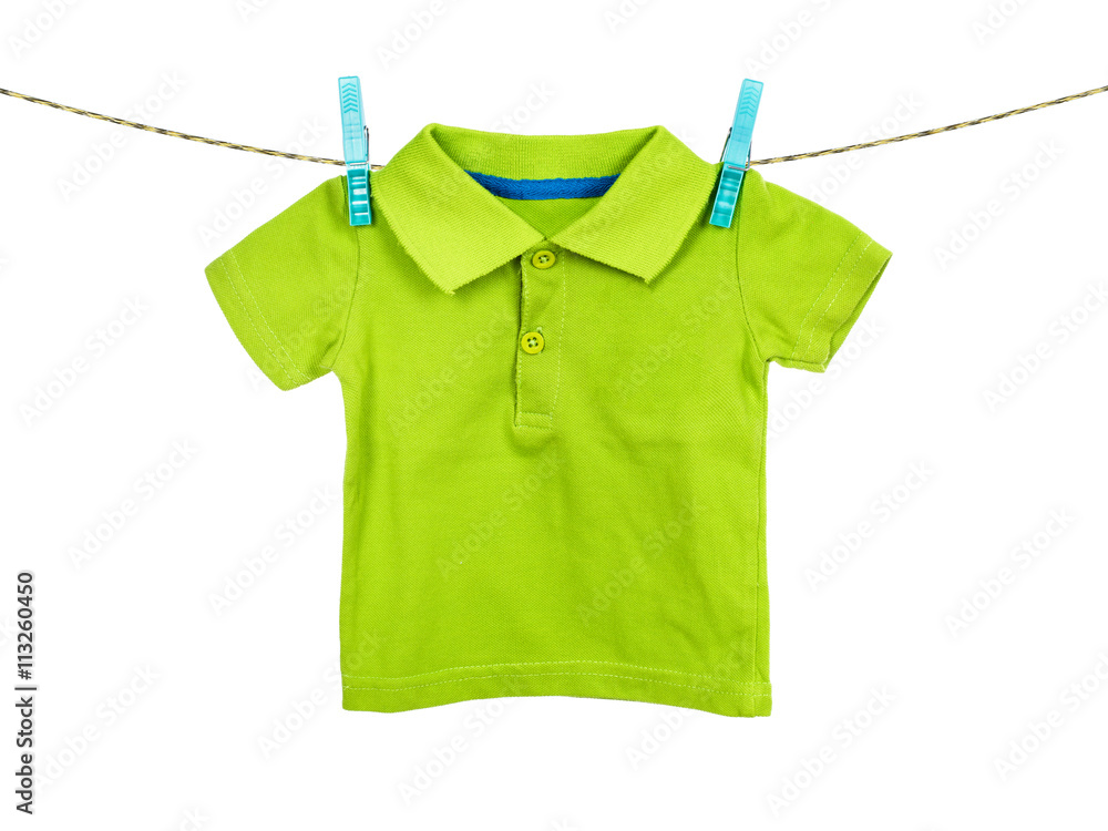 Child t-shirt hanging on the clothesline on white background