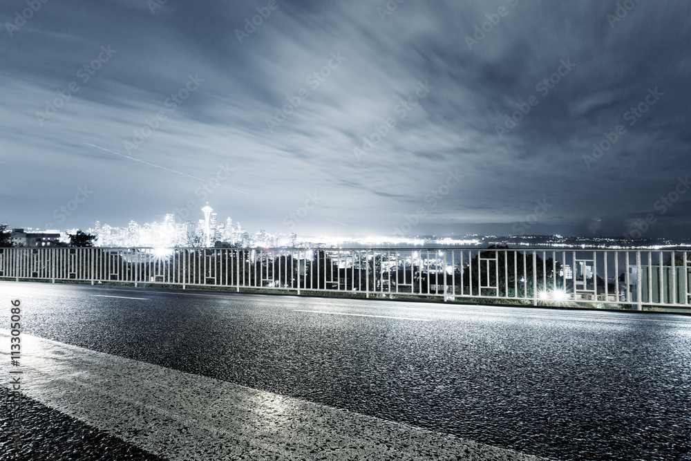 empty asphalt road with cityscape and skyline of seattle