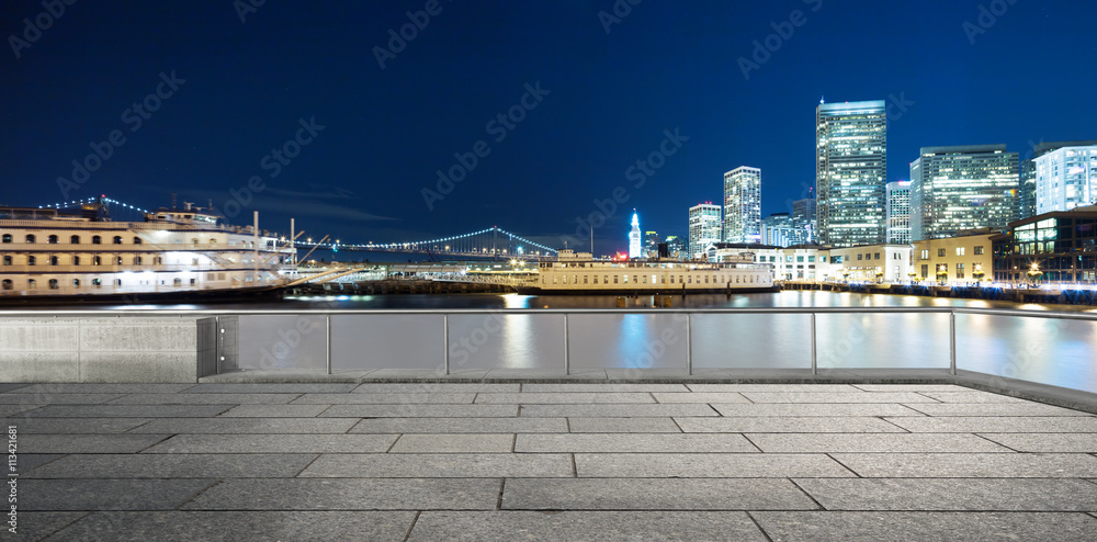 empty floor with modern buildings near water in san francisco