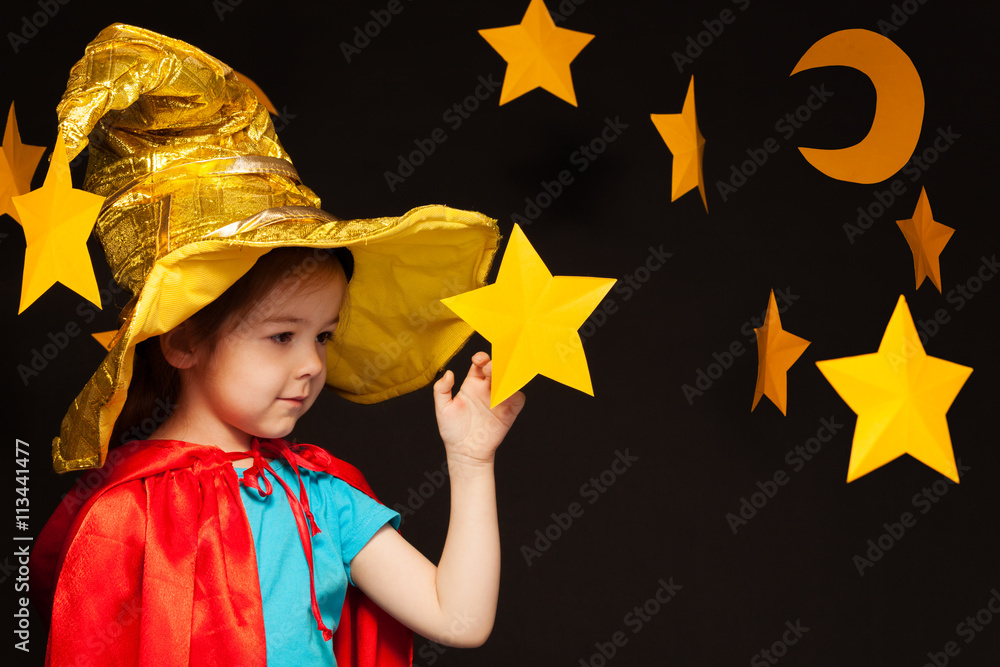 Little girl playing sky watcher with handmade star