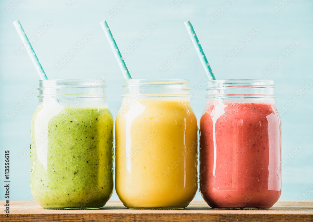 Freshly blended fruit smoothies of various colors and tastes