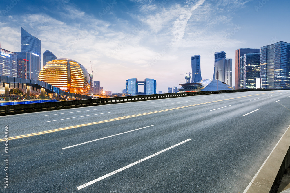 Asphalt roads and beautiful scenery of the city at night in Hangzhou