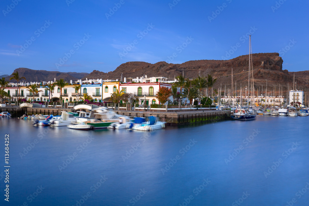 Marina of Puerto de Mogan at night, a small fishing port on Gran Canaria, Spain.