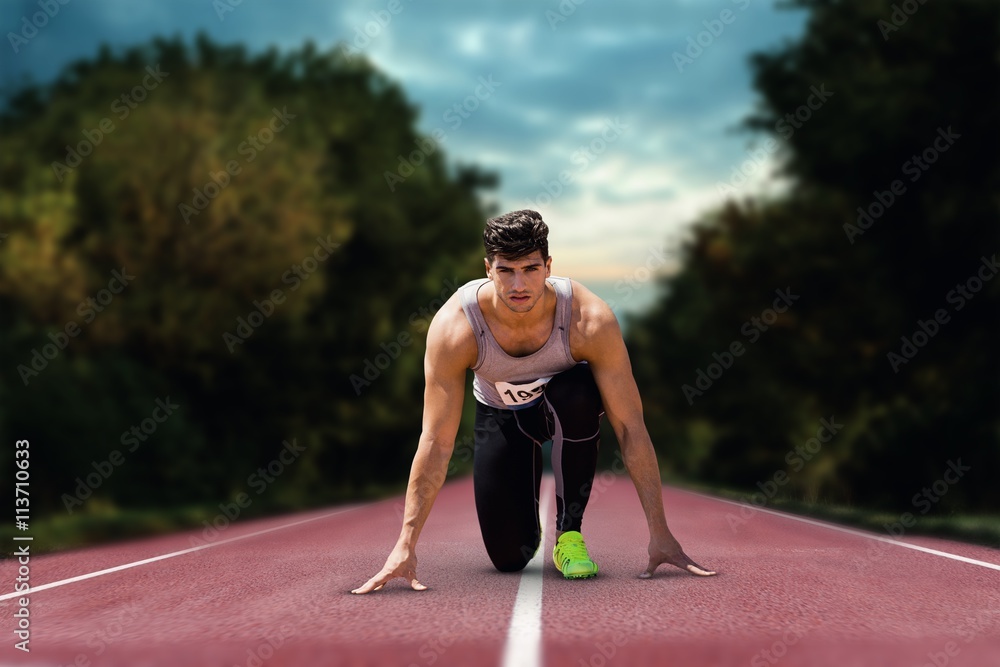 Composite image of sportsman waiting on the starting line 