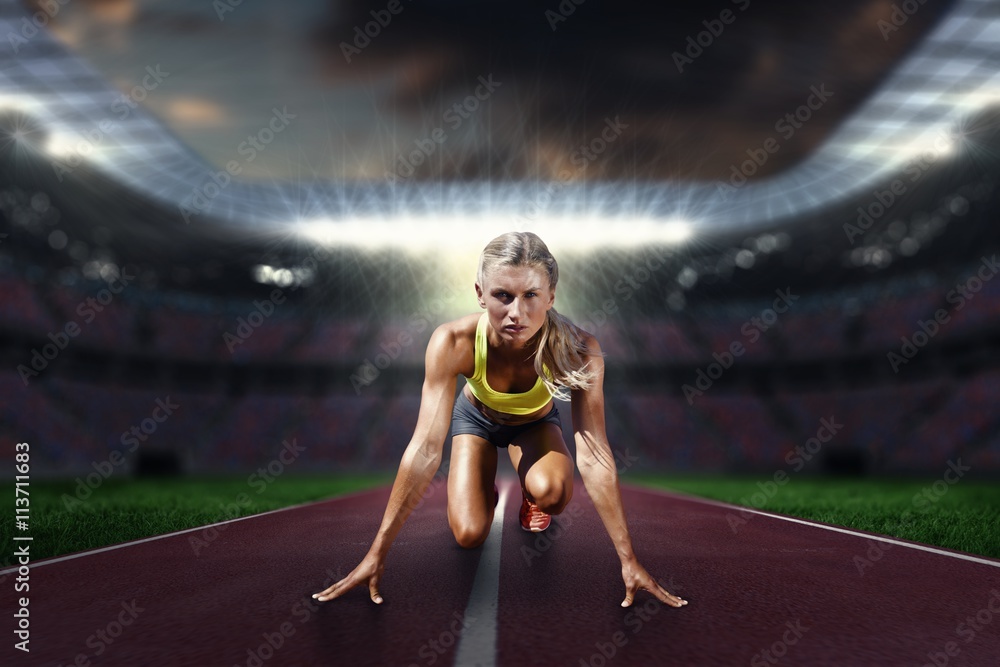 Composite image of woman in the starting block