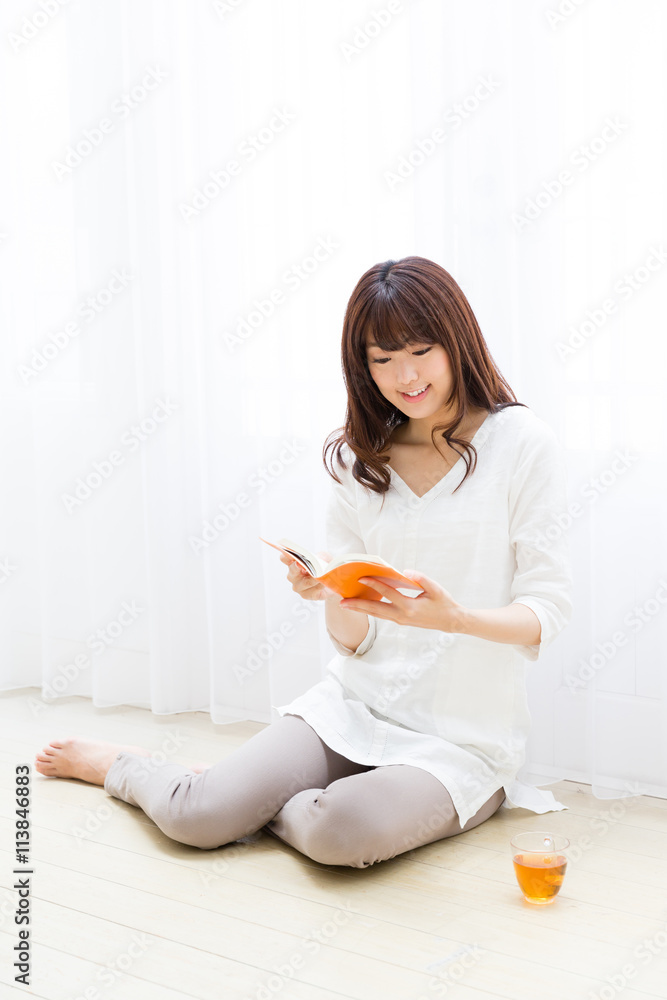 attractive asian woman reading book