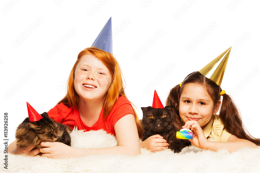 Two girls play party game with their cats