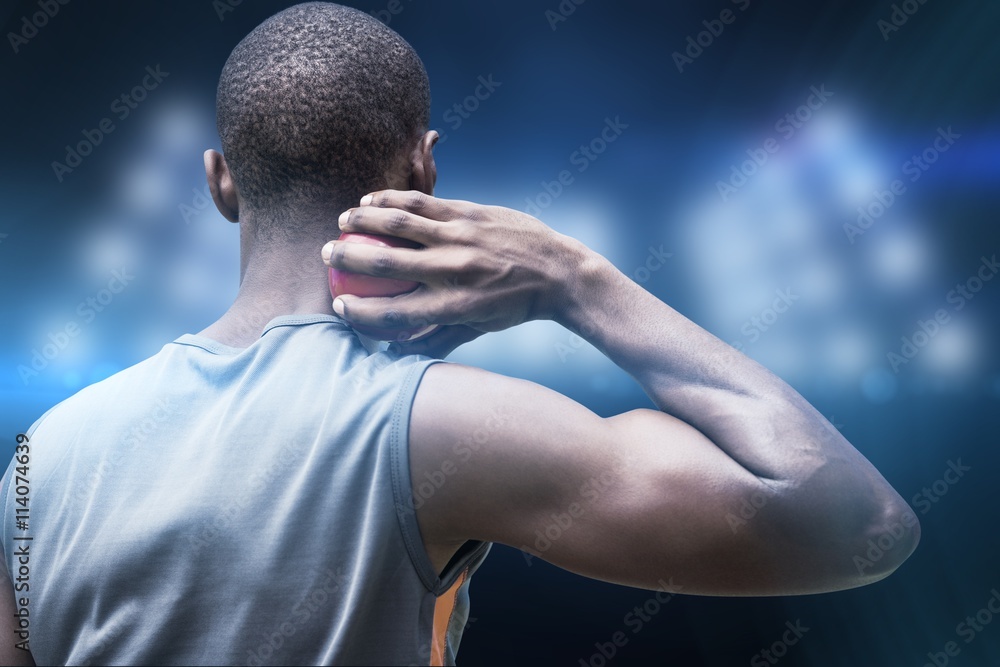 Composite image of rear view of sportsman practising shot put 