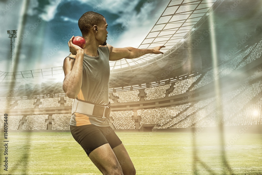 Composite image of rear view of sportsman practising shot put 