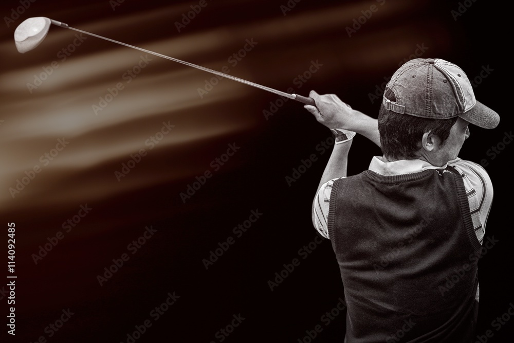 Portrait of golf player taking a shot 