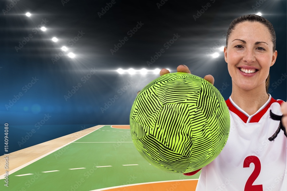 Sportswoman holding a ball 