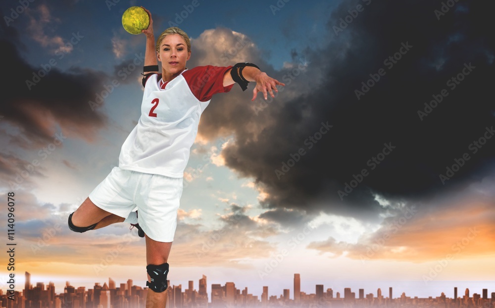 Composite image of sportswoman throwing a ball