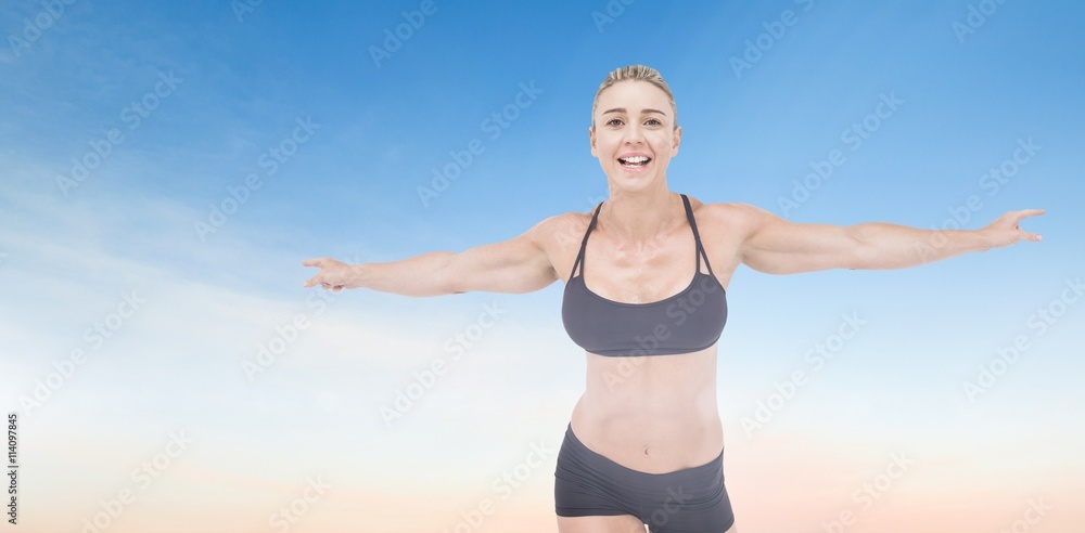 Female athlete raising arms