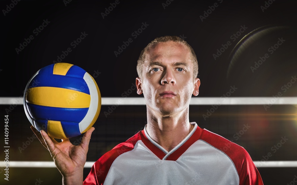 Composite image of sportsman holding a volleyball