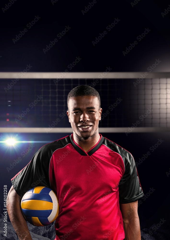 Composite image of sportsman holding a volleyball