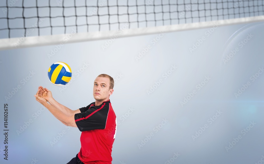 Composite image of sportsman posing while playing volleyball