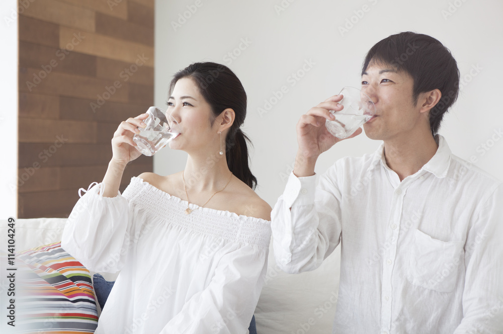 Young couple are drinking delicious water