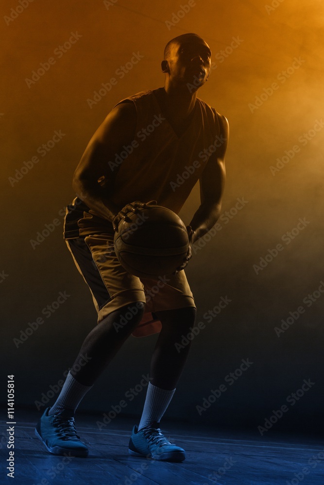 Portrait of basketball player preparing to score 