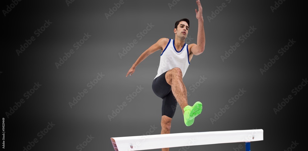 Male athlete running on black background