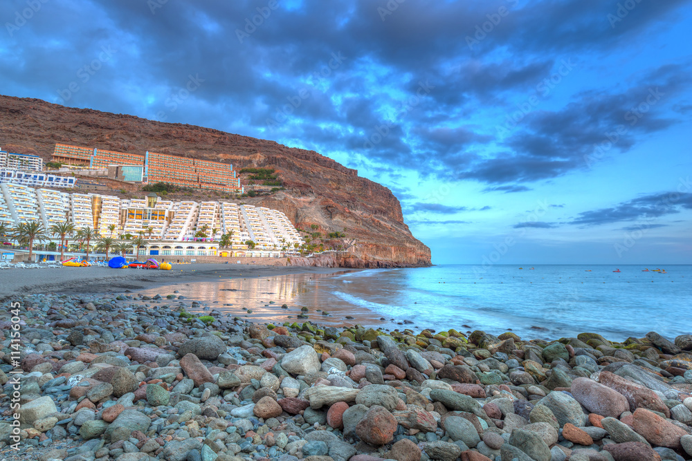 Atlantic beach of Gran Canaria island in Taurito at sunset, Spain