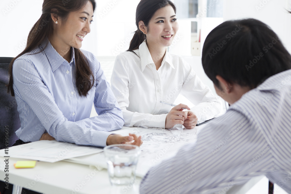 Office scene with a happily meeting