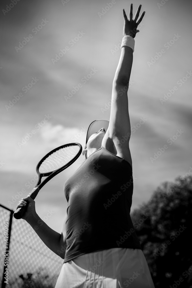 Pretty tennis player about to serve