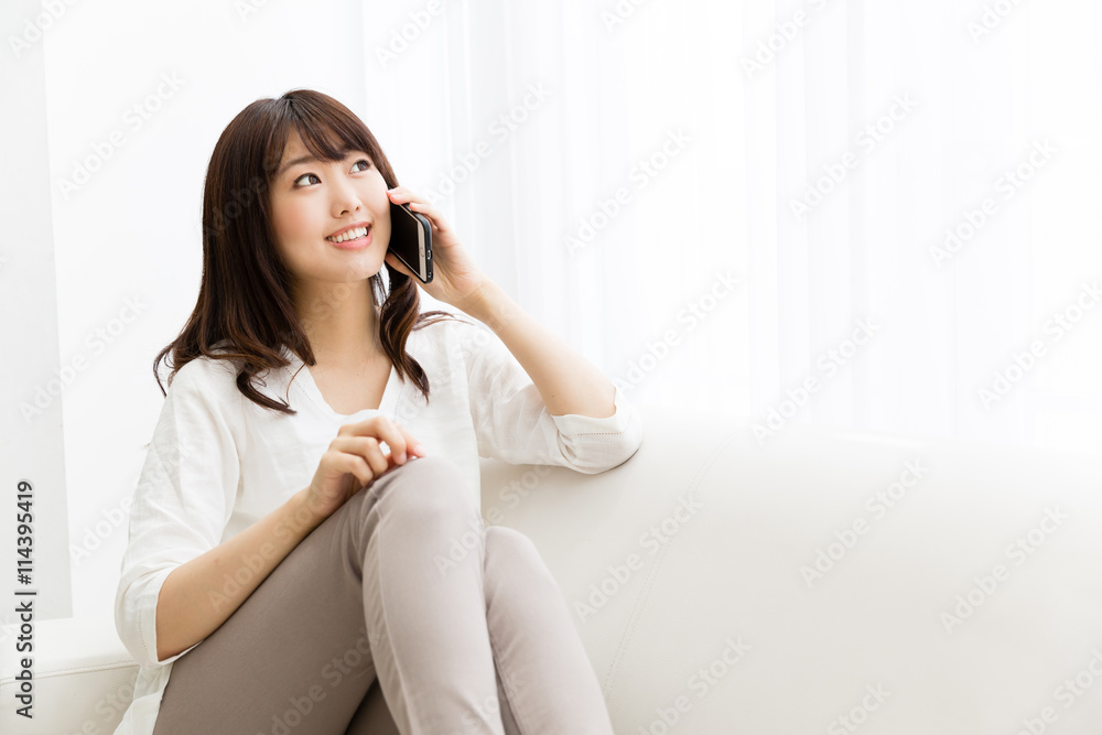 attractive asian woman using smart phone