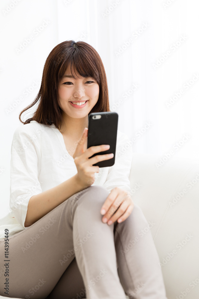 attractive asian woman using smart phone