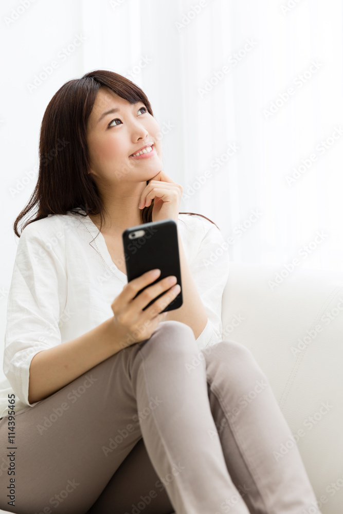 attractive asian woman using smart phone