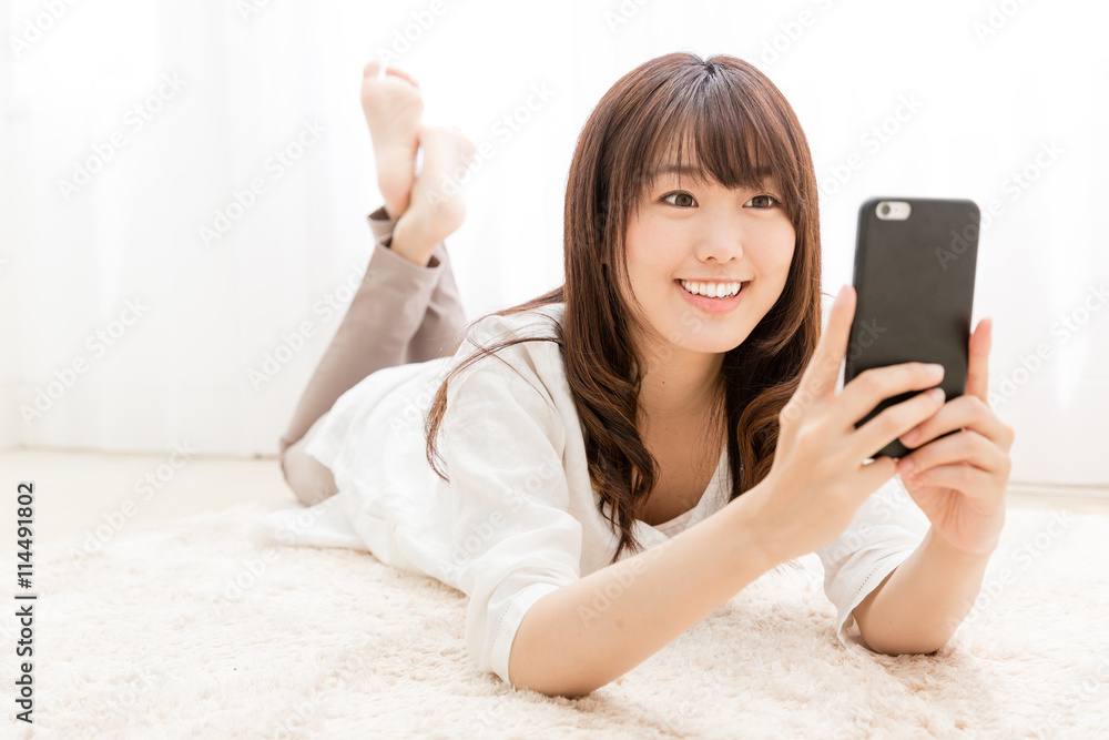 attractive asian woman using smart phone